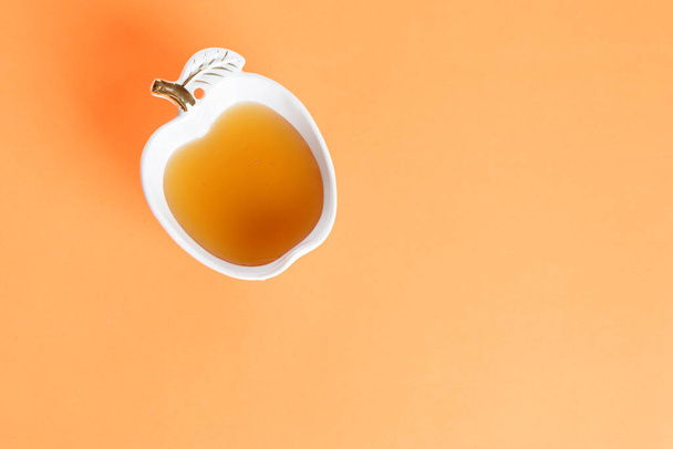 Fresh honey in a glass bowl. Top view,copy space, vivid background. Minimal style. - Foto, immagini