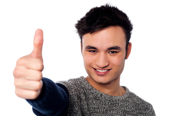 Handsome young man with thumbs up - Photo, Image
