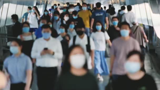 Slow motion of unrecognized people wearing medical face masks at metro in Hong Kong. Coronavirus concept - Footage, Video
