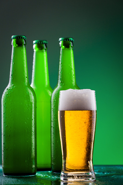 Beer bottles with full glass - Foto, imagen