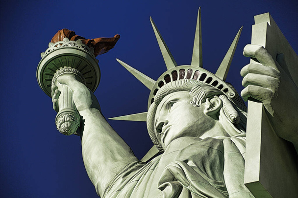 The Statue of Liberty is a colossal copper statue designed by Auguste Bartholdi a French sculptor was built by Gustave Eiffel.Dedicated on Oct 28, 1886.One of most famous icons of the 4th of July USA. - Photo, Image