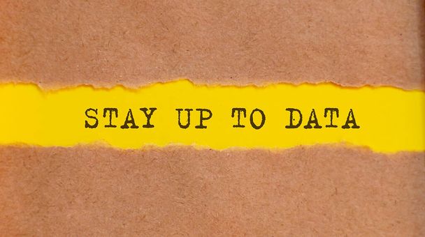 STAY UP TO DATA message written under torched paper. Obchod, technologie, internetový koncept. - Fotografie, Obrázek