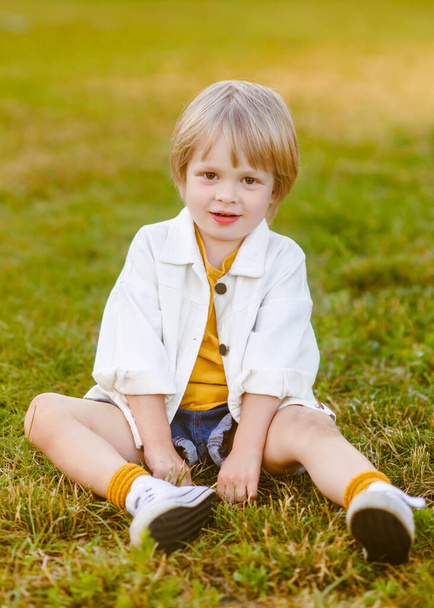 portrait of little model boy in nature - Фото, зображення