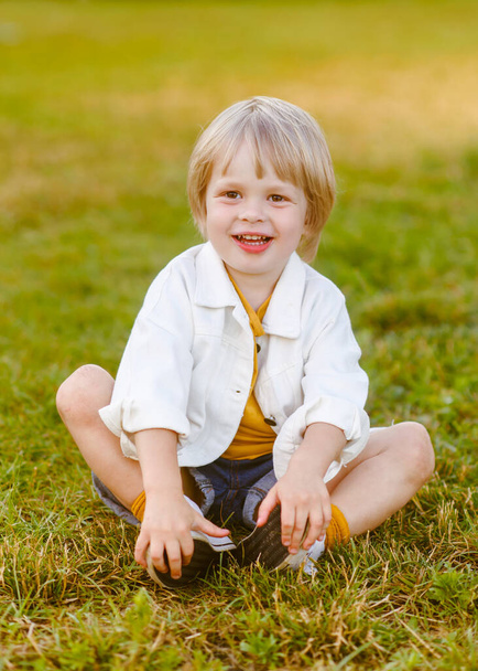 portrait of little model boy in nature - Fotó, kép