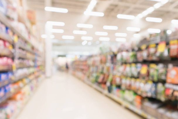 Abstract blur supermarket discount store aisle and product shelves interior defocused background - Photo, Image