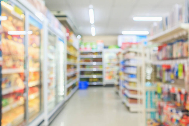 Supermarket aisle interior shelves blur background - Foto, afbeelding