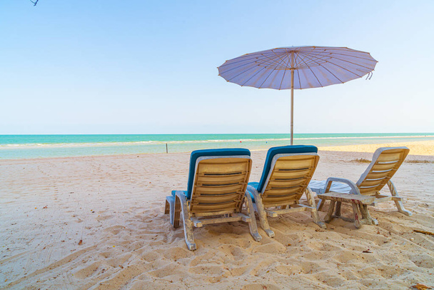 empty beach chair on sand with ocean sea background - Φωτογραφία, εικόνα