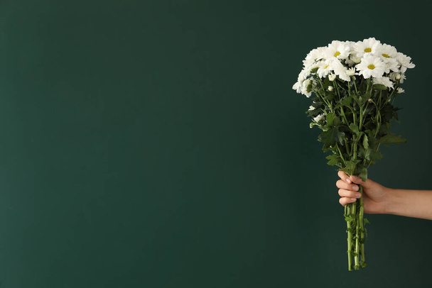 Woman holding beautiful bouquet near green chalkboard, space for text. Happy Teacher's Day - Fotoğraf, Görsel