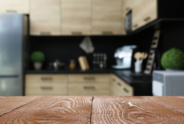 Wooden table in kitchen. Space for design - 写真・画像