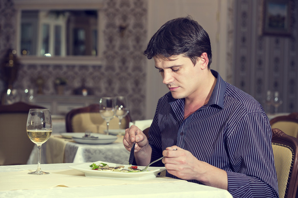 Young man having dinner - Foto, Imagem