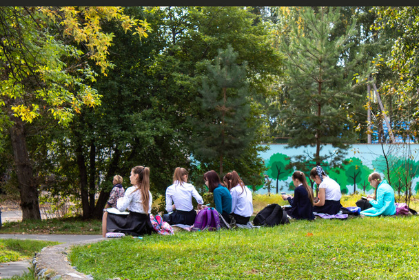 A group of schoolgirls spends outdoor activities in the city park. - Photo, Image