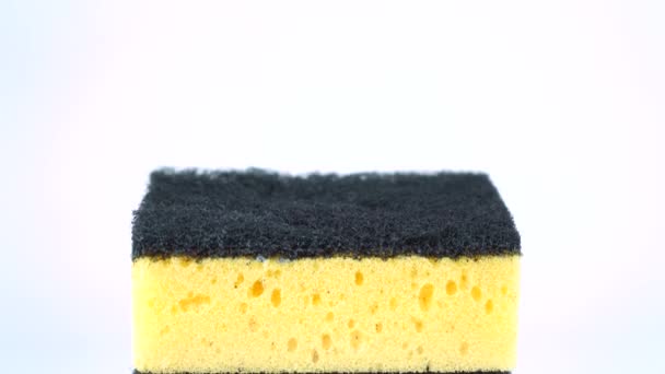 Stack of yellow dishwashing sponges isolated on white background - Footage, Video