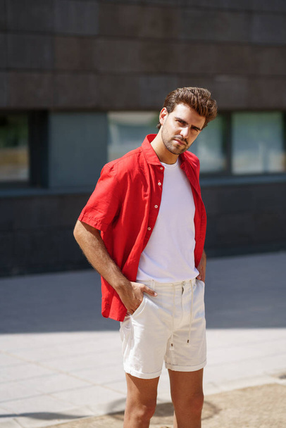 Fashionable man standing outdoors wearing casual clothes - Foto, Imagem