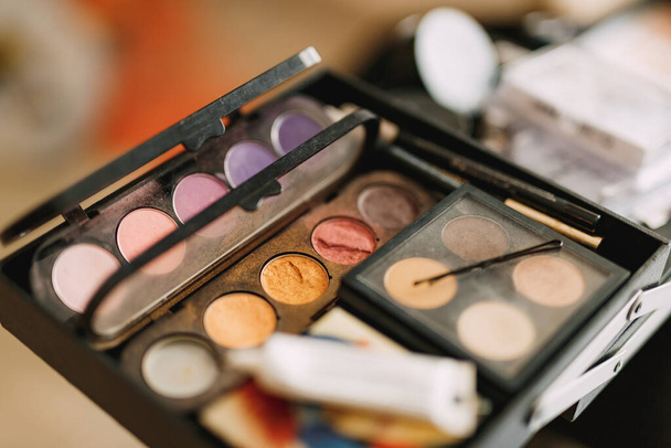 Makeup artist set. Close-up of a palette of eyeshadows in different colors. - Photo, Image
