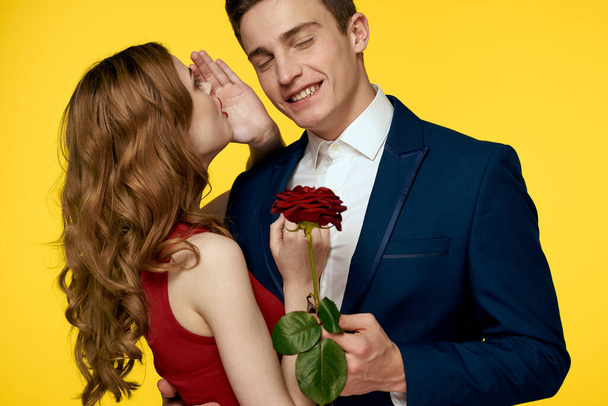 Couple in love man and woman with red rose classic costume red dress model - Photo, Image
