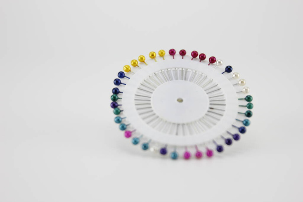 Lot of colorful pins isolated on a white background. - Photo, Image
