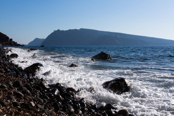 sandstone coast in Santorini by sunny day - Fotó, kép