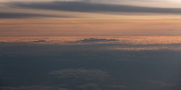 Clouds scape at sunset from above - Photo, Image