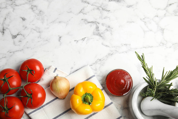 Flat lay composition with ingredients for cooking on white marble table. Space for text - 写真・画像