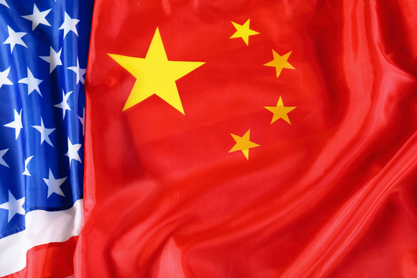 USA and China flags as background, top view. International relations - Foto, Bild