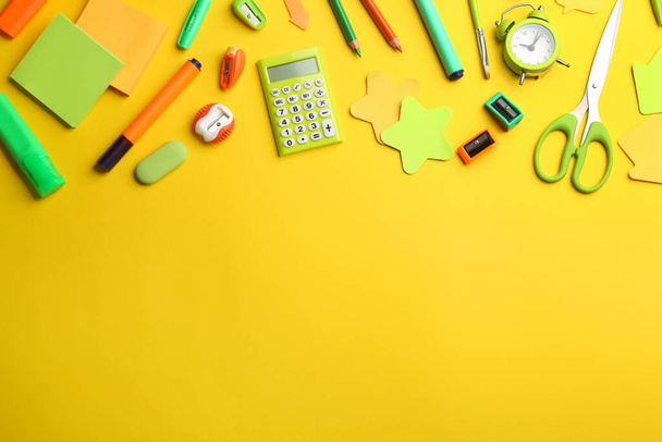 School stationery on yellow background, flat lay with space for text. Back to school - Φωτογραφία, εικόνα