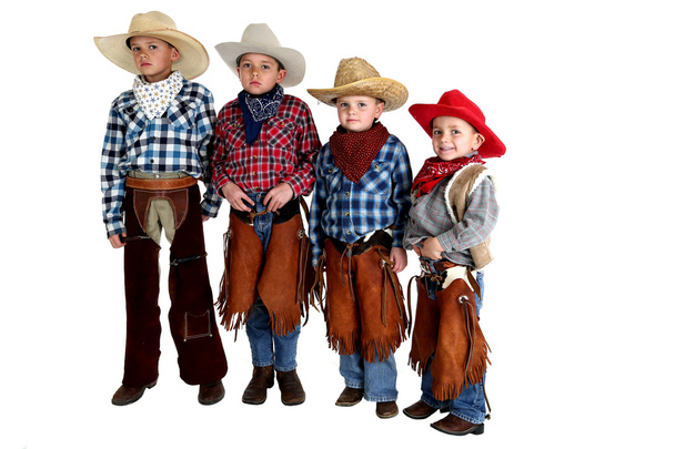 four cowboy brothers standing wearing hats and chaps - Foto, Bild