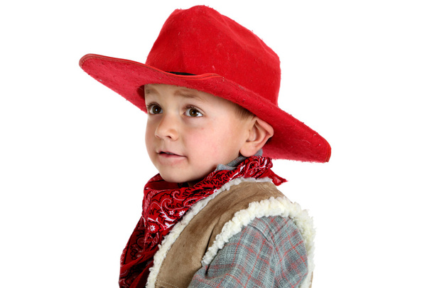 Cute young cowboy in a red cowboy hat and bandana - Foto, Imagen