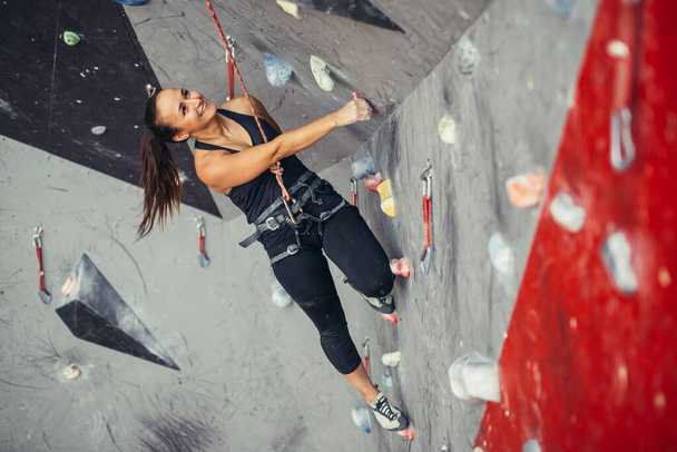 sporty woman in boulder climbing hall - Photo, image