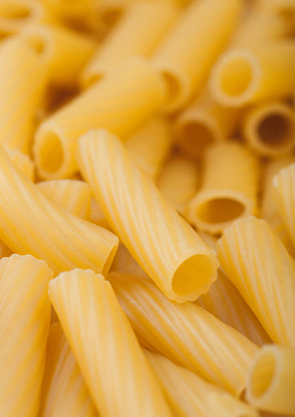 Fresh raw italian homemade penne pasta close up background. Macro - Foto, immagini