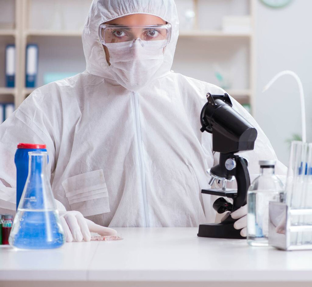 Young chemist student working in lab on chemicals - Φωτογραφία, εικόνα