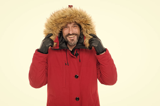 Giving the man a sense of style. Happy fashion model wear fur hood isolated on white. Mature man in winter style. Bearded man in casual style outfit. Keeping style and providing warmth - Fotó, kép