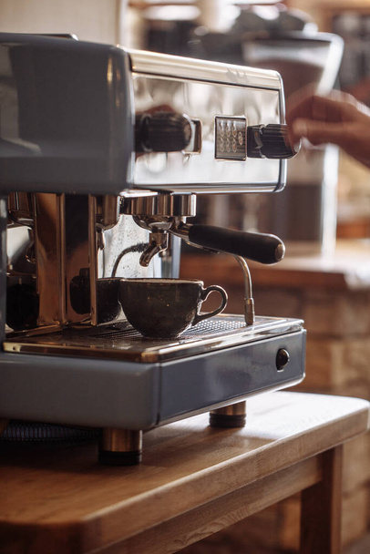 hands are going to use the coffee machine - 写真・画像