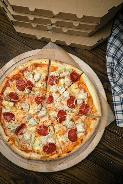 Pizza, in stock. on a brown wooden table. - Photo, Image