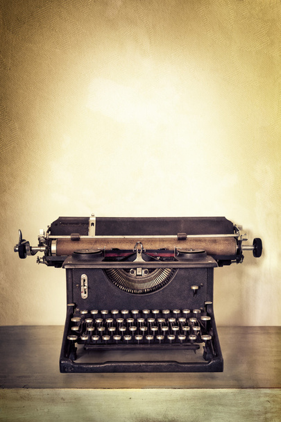 Vintage Typewriter on Old Desk with Grunge Background - Photo, Image
