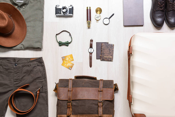 Set of travel accessories for men on wooden background - Φωτογραφία, εικόνα