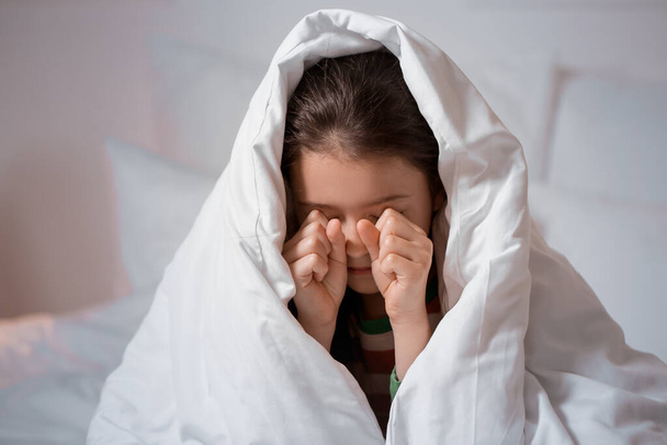 Little girl suffering from sleep disorder in bedroom - Фото, зображення