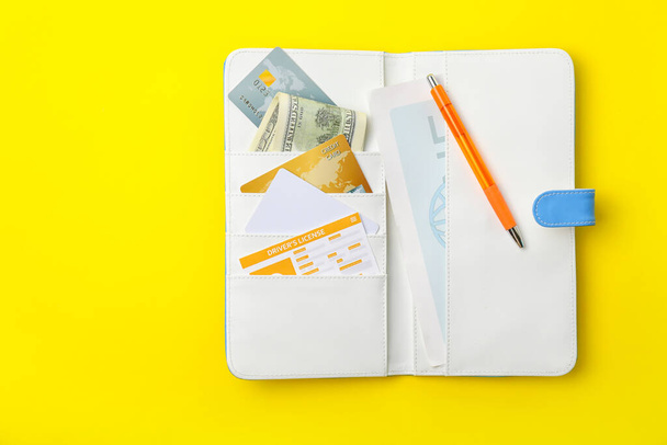 Travel organizer with different things on color background - Foto, afbeelding