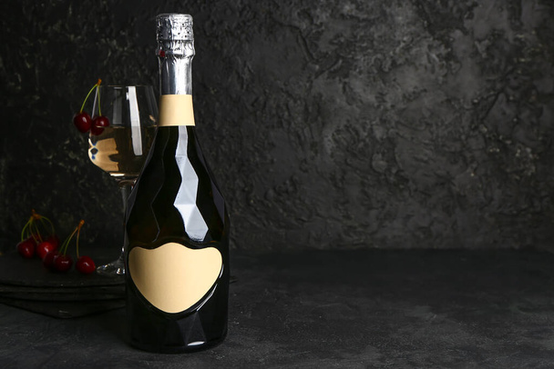 Bottle of champagne on dark background - Zdjęcie, obraz