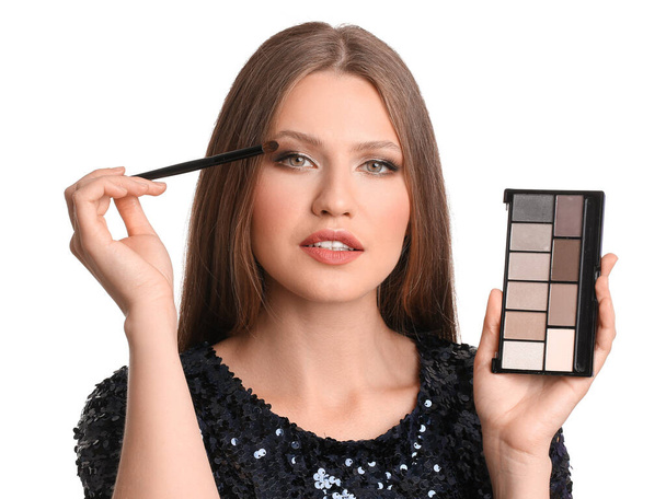 Young woman with beautiful eyeshadows on white background - Foto, Imagen