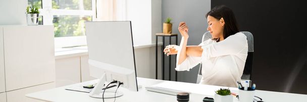 Woman Stretches At Office Desk. Stretch Exercise On Chair - Photo, image