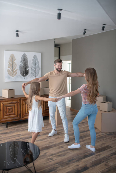 Parents and daughter dancing and feeling amazing - Photo, Image