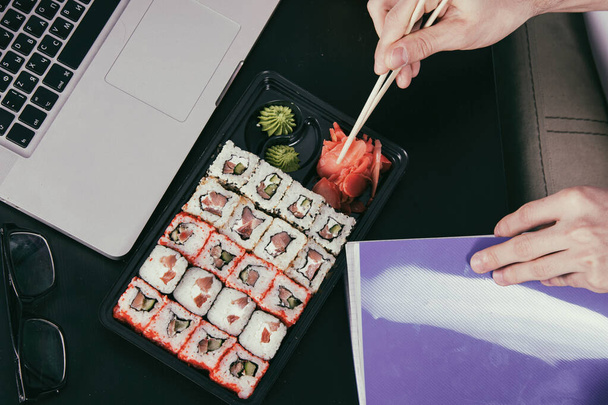 Sushi. Work and study at home. - 写真・画像
