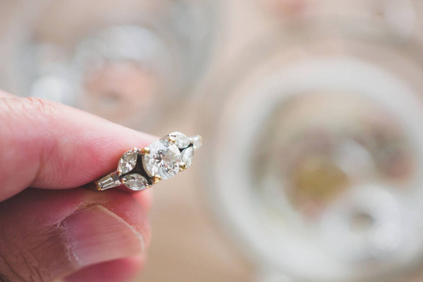 Jeweller hand cleaning vintage jewelry diamond ring closeup - Photo, Image