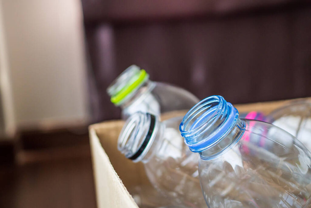 plastic bottles in recycling paper box reuse concept - Φωτογραφία, εικόνα
