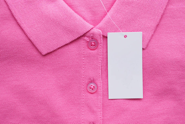 Blank white clothes tag label on new shirt - Photo, Image