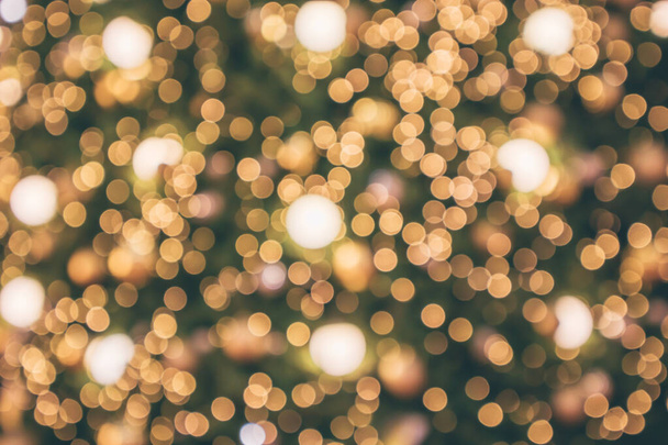 Abstraktes Weihnachtsfest mit festlichem Gold-Bokeh-Licht auf verschwommenem Hintergrund - Foto, Bild