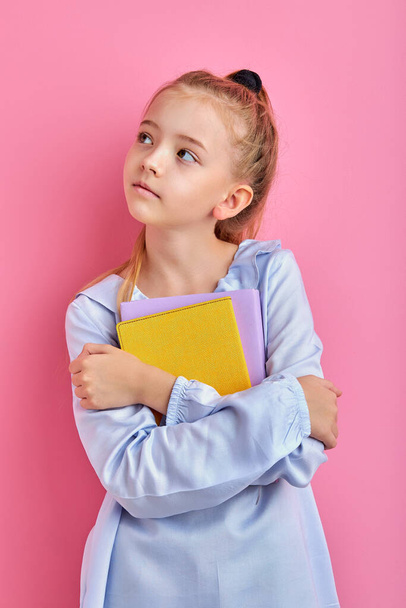 sweet caucasian child girl with books isolated - Фото, зображення