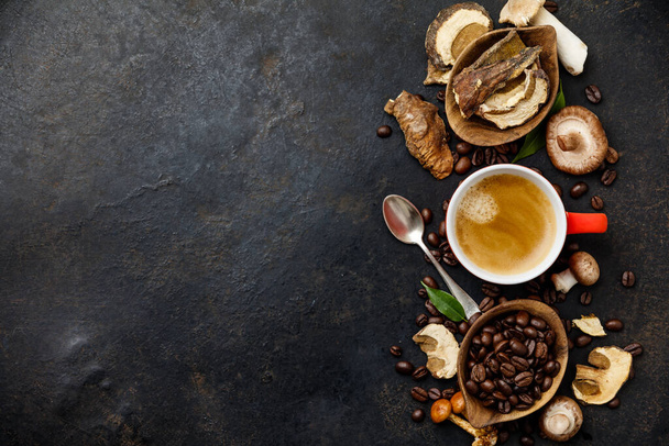 Mushroom Chaga Coffee Superfood Trend-dry and fresh mushrooms and coffee beans on dark background - Photo, Image