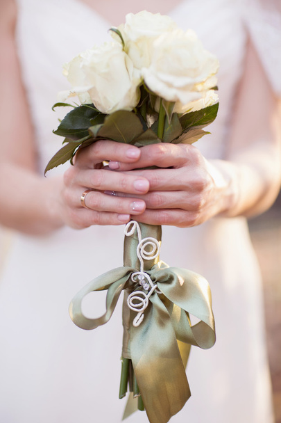 Bridal bouquet in the hands of the bride - Φωτογραφία, εικόνα