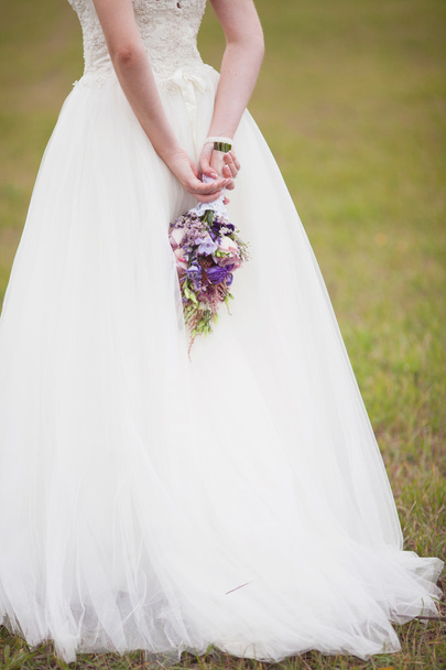Bridal bouquet in the hands of the bride - Фото, зображення
